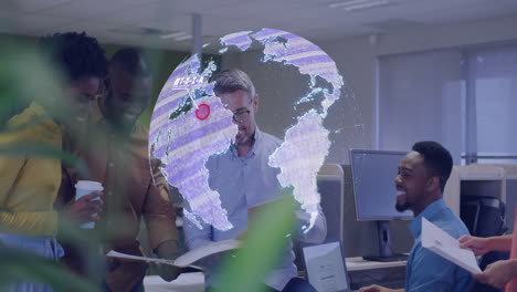 digital globe animation over diverse business team collaborating in modern office