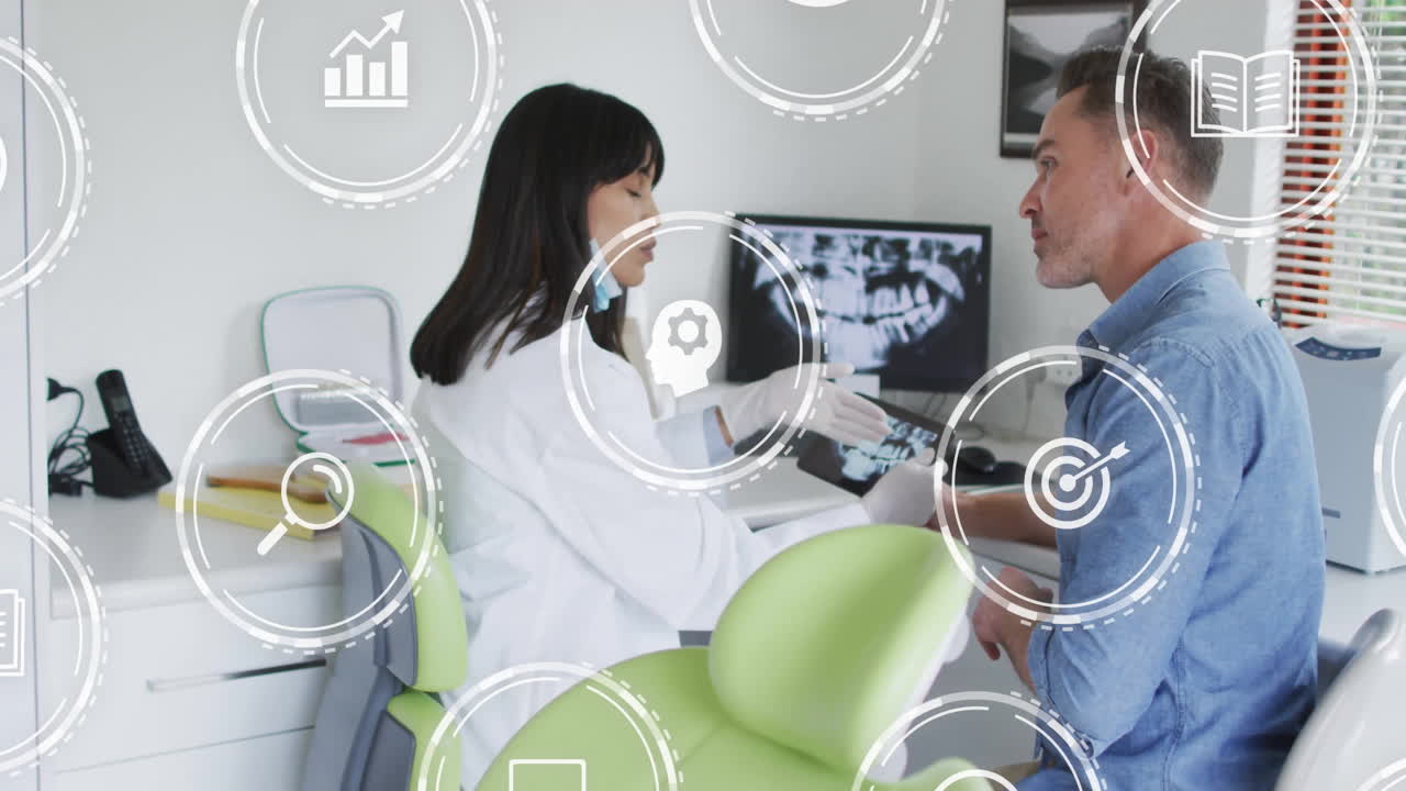 Dentist discussing dental X-ray with patient, surrounded by digital icons animation