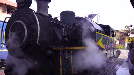 old steam train in station, india