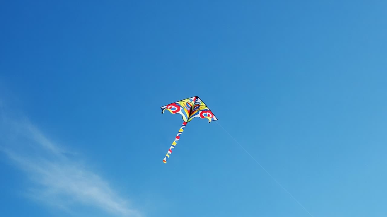A Vibrant Kite Soaring Against a Clear, Blue Sky Capturing the Joy and Freedom of Outdoor Activities Under Bright Sunshine