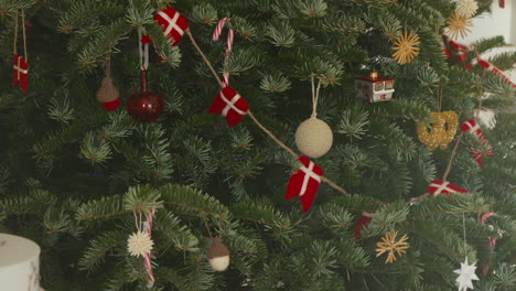 traditional danish christmas tree adorned with red and white decorations