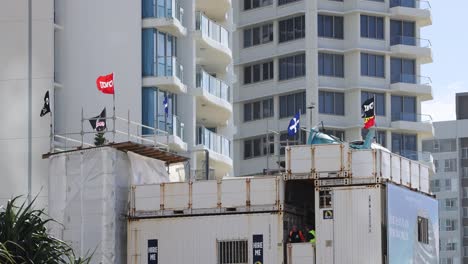 flags waving at a construction site