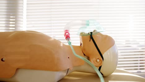 dummy patient simulated mannequin wearing oxygen mask