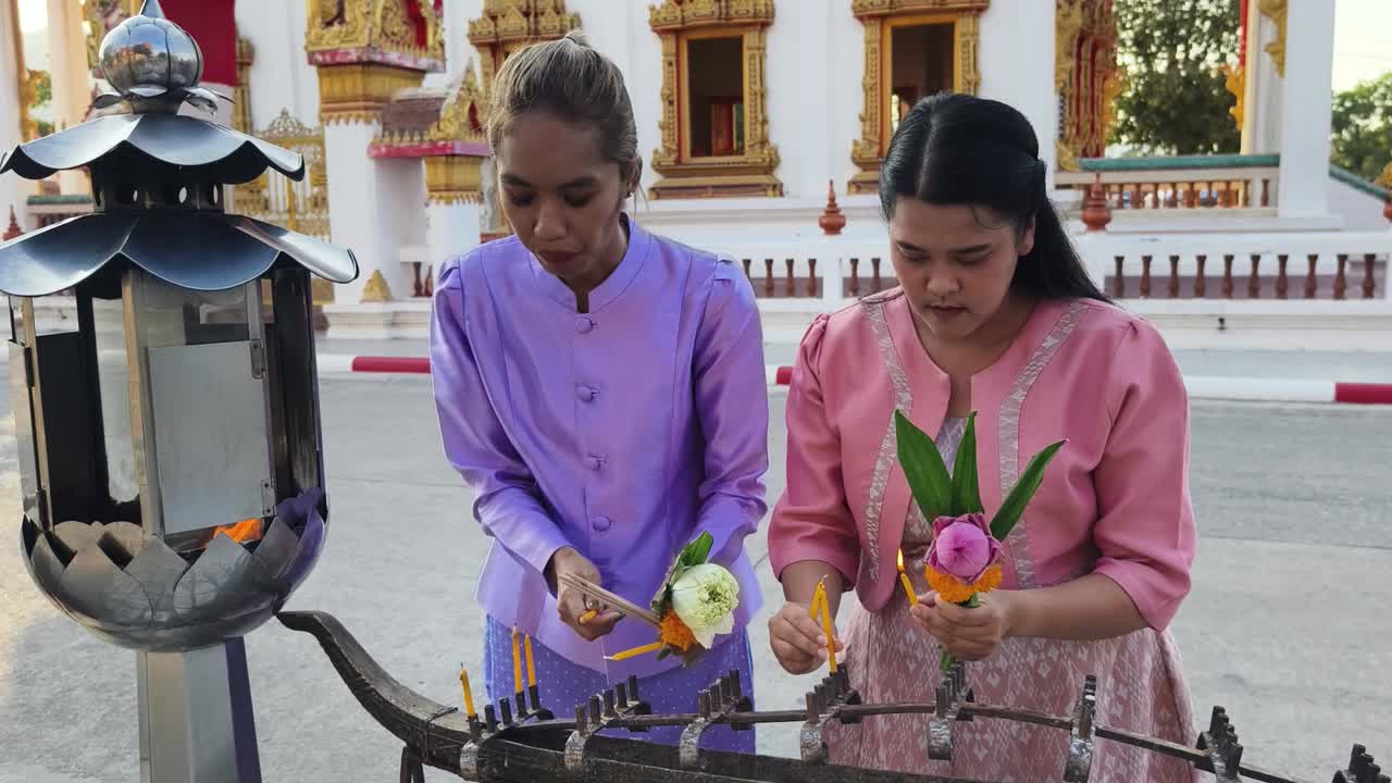 Women Praying at a Thai Temple