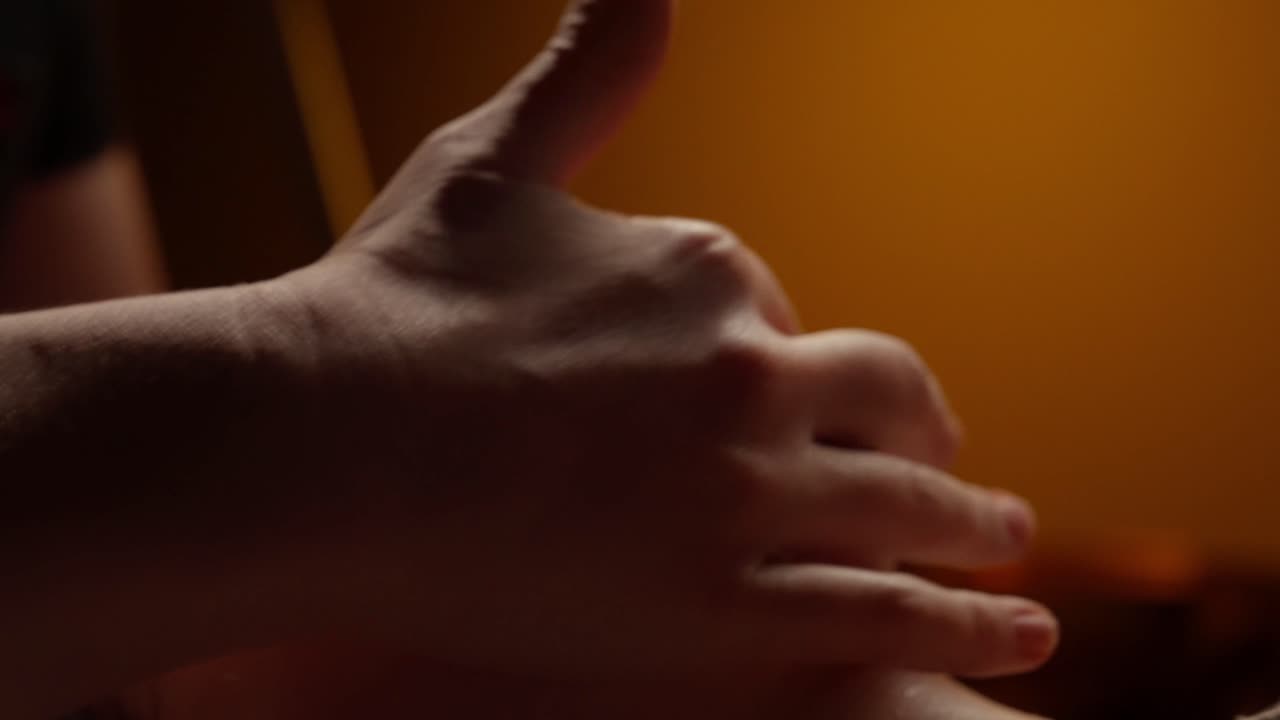 Close-up of Woman Receiving Relaxing Facial Massage at Spa