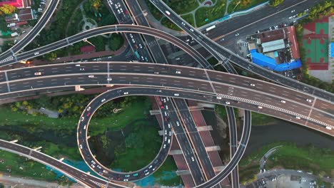 aerial photography of urban transportation roads aerial vehicle driving on urban overpass busy urban transportation aerial photography of crisscrossing urban overpasses