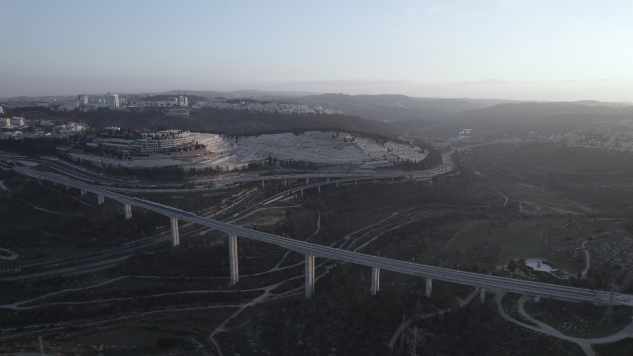 Aerial View of Train Crossing Bridge Near Mount Herzl Cemetery in Jerusalem