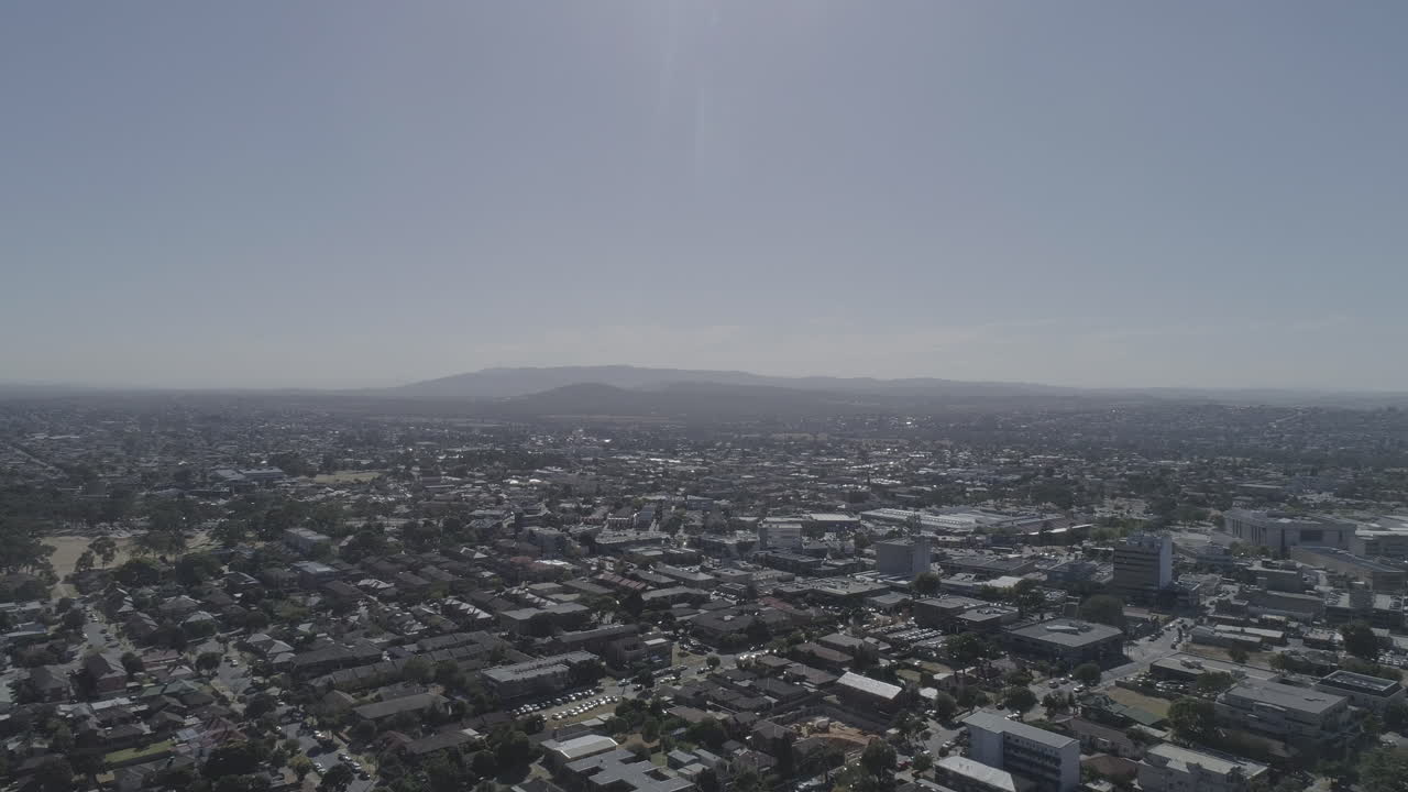 High altitude aerial perspective of south eastern suburbs of Melbourne, Victoria, Australia looking toward the Dandenong Rangers