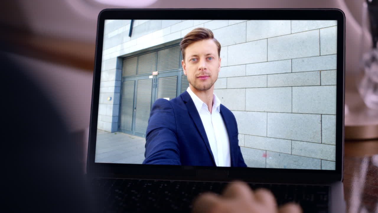 Business man have videoconference by laptop in apartment smiling close up