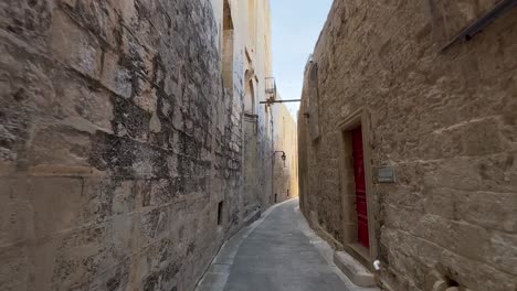 4k gimbal of the narrow and old streets of mdina, malta's historic old capital, a unesco heritage site with baroque architecture, rich history, and enchanting surroundings