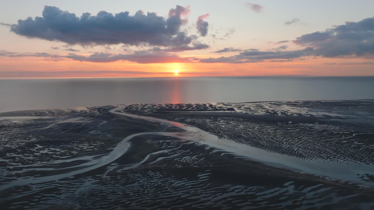 Sun Setting Over Irish Sea And Tidal Sand Flats Nature Reserve With Intricate Sand Patterns And Tributaries. Golden Hour. Fleetwood, Lancashire, UK