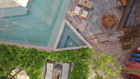 Alea-Tulum-hotel-resort-in-a-tropical-climate-offering-guests-luxury-accommodation-with-amenities,-swimming-pools-and-extensive-greenery-in-the-form-of-palm-trees