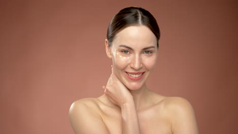 woman with skincare products on her face