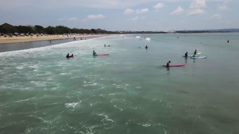 surfers at a beautiful beach in bali