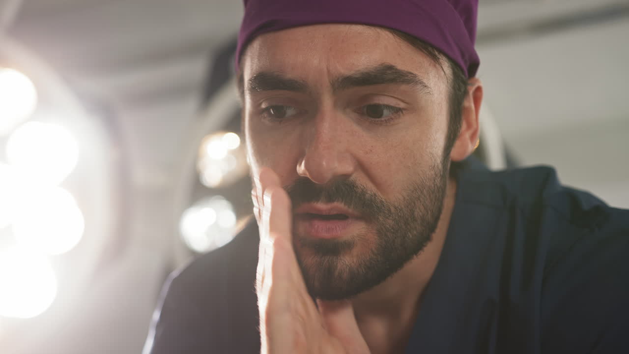 Surgeon taking a moment