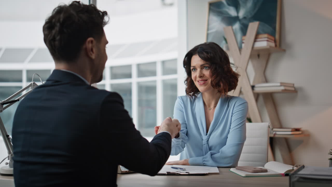 Businesswoman signing deal businessman at office closeup. Woman shaking hands