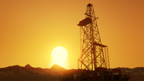 A-big-drill-rig-during-sunrise-on-the-oil-field.-A-metal-construction-used-in-the-petrochemical-industry.-Equipped-with-large-drills-the-structure-can-drill-oil-wells-or-natural-gas-extraction-wells.