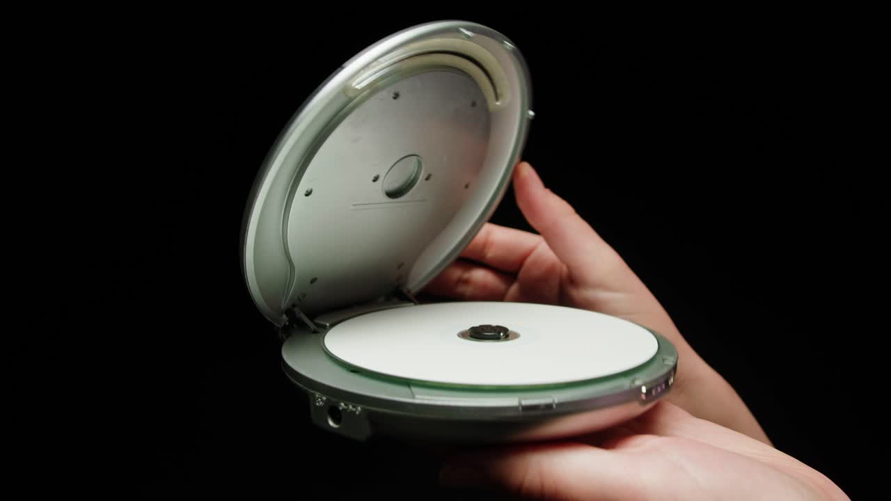 Vintage cd music player close-up. Using portable music player for listening with compact disc