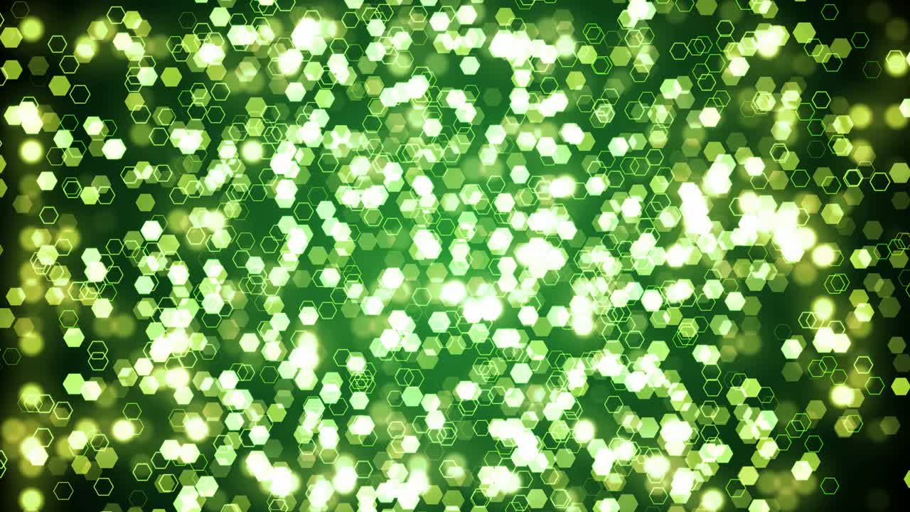 Green glitter hexagon sparkles on dark background. Abstract animation.