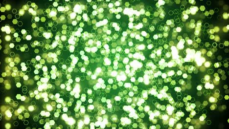 green glitter hexagon sparkles on dark background. abstract animation.