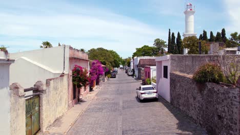 quiet street in colonia del sacramento with view of lighthouse in uruguay