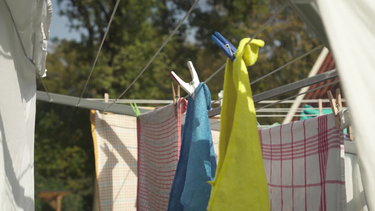 Clothing Hung On Clothesline Outdoor Secured With Clothespins
