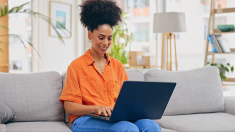 laptop, thinking and woman typing on sofa in home
