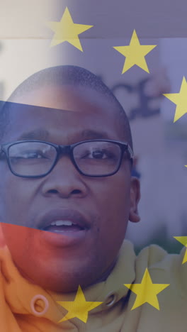 animation of flag of russia and european union over african american male protester