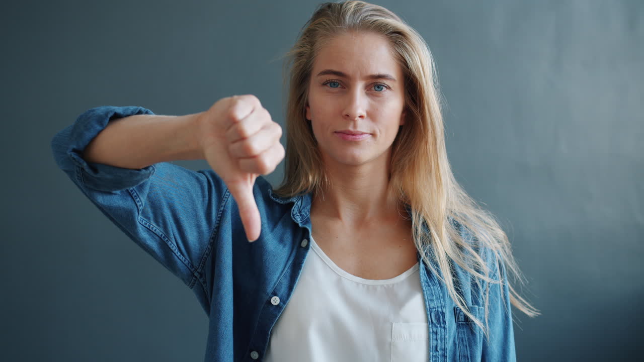 Woman giving a thumbs down