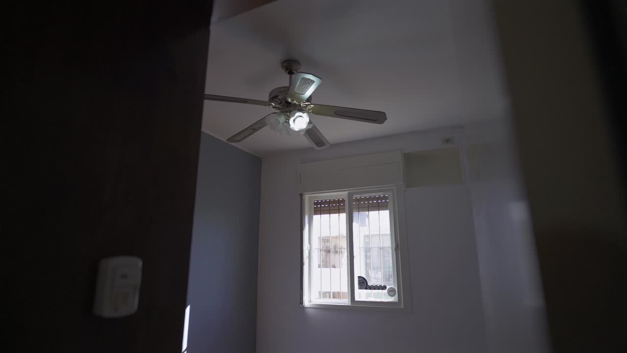 Smooth hallway-to-room transition reveals airy sleeping space with natural light. Ideal for rental tours and Airbnb listings.