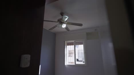 smooth hallway-to-room transition reveals airy sleeping space with natural light. ideal for rental tours and airbnb listings.