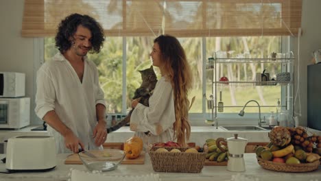 couple relaxing in a tropical kitchen
