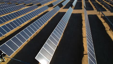 solar panel farm aerial side view in mojave desert, eco environmental concept