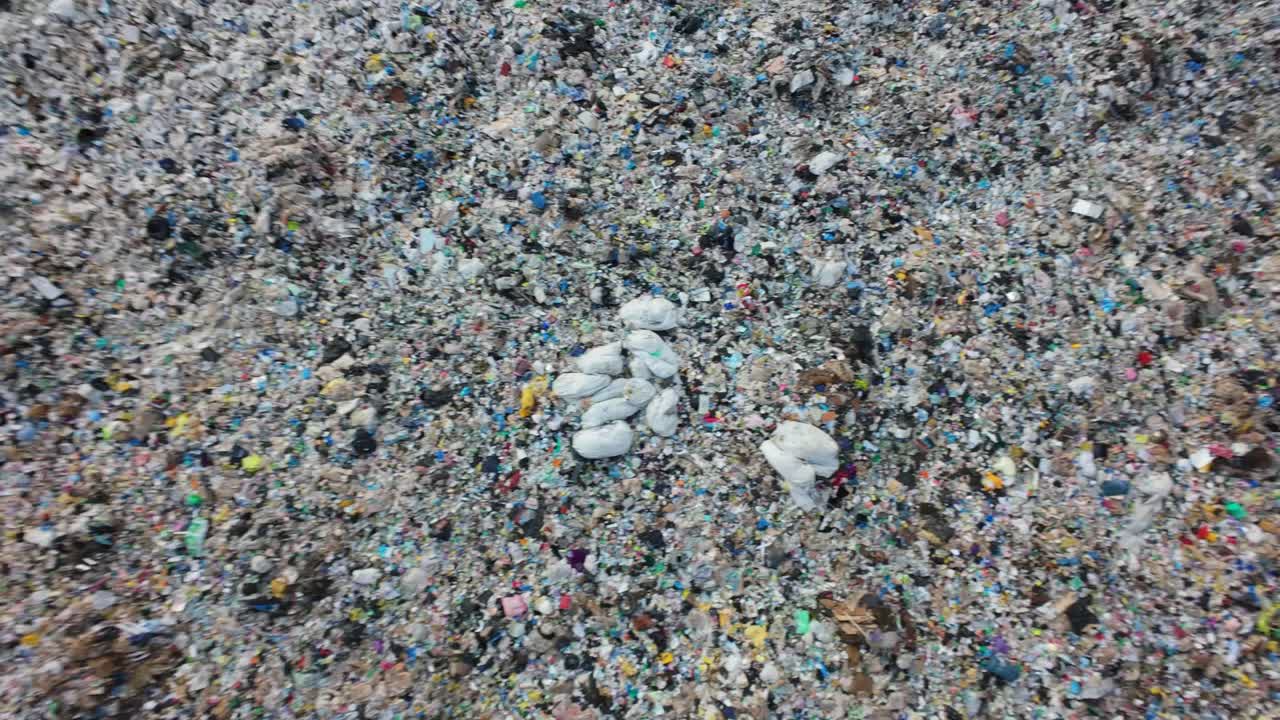 A comprehensive look at a household waste dump reveals mountains of garbage piled high, showcasing the stark reality of waste accumulation