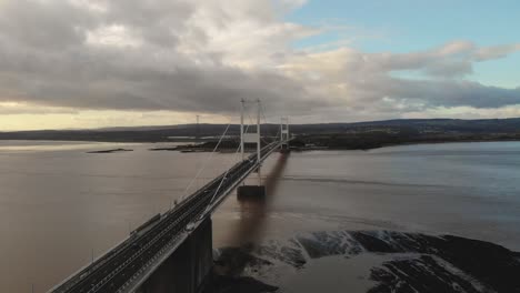 Turning-drone-shot-of-the-Severn-Bridge-linking-England-with-Wales-near-to-Bristol,-UK