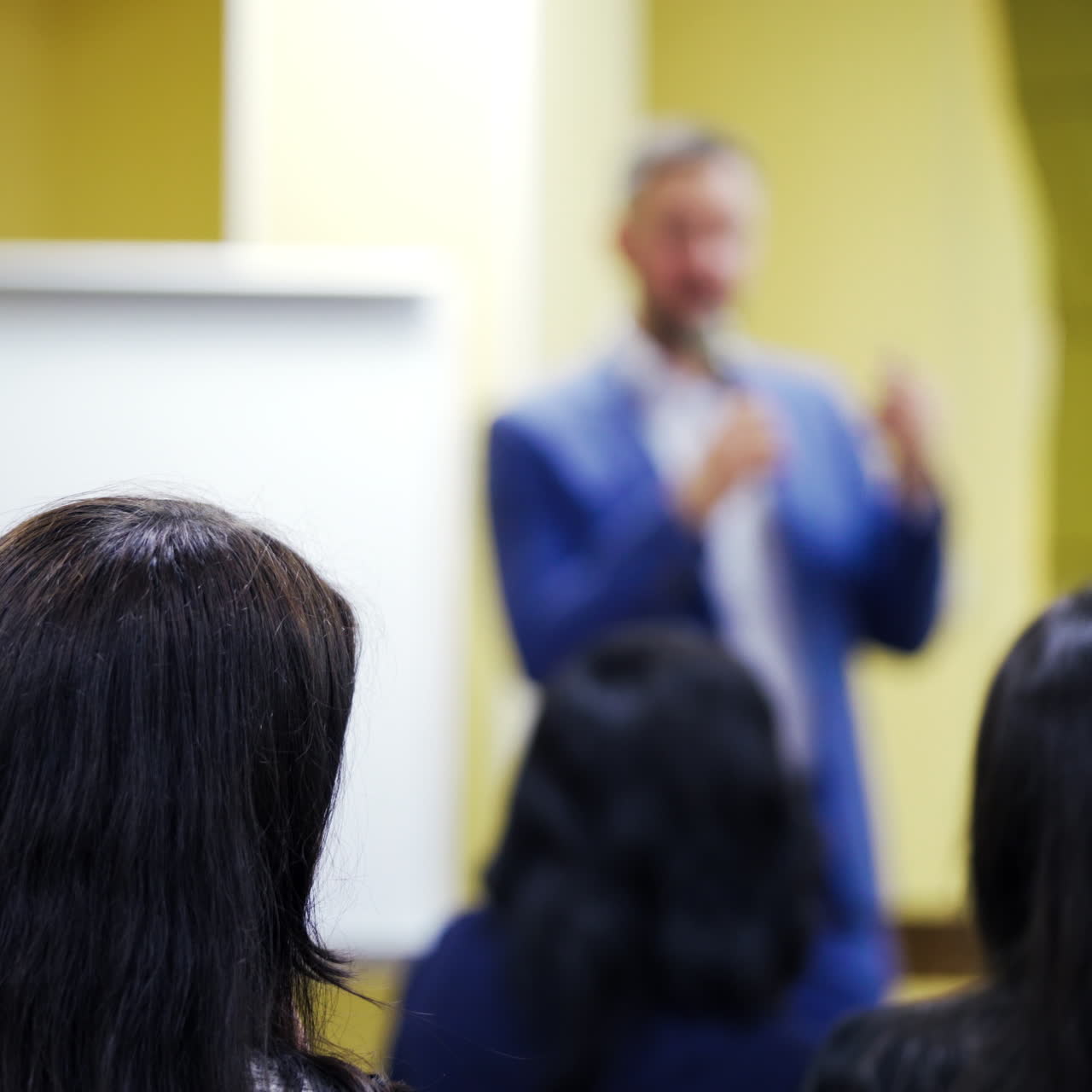 Conference hall full of people participating in the business training