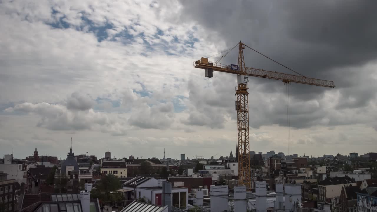 Timelapse video of a construction crane working on a historical building in the center of Amsterdam