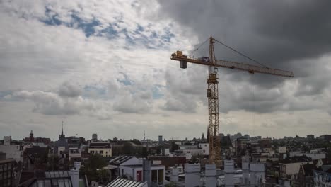 timelapse video of a construction crane working on a historical building in the center of amsterdam
