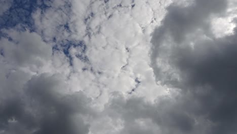 hyper lapse of beautiful fluffy white beautiful cloud formations in a deep blue summer sky