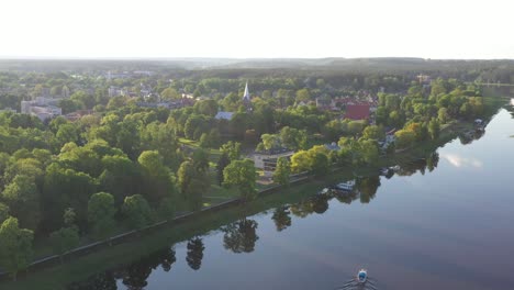 Drone-aerial-view-of-small-ship-in-Nemunas-river,-Birstonas,-Lithuania