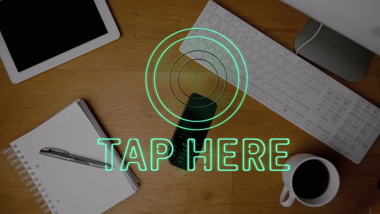 Phone falls on desk with computer, tablet, coffee and notepad in slow motion