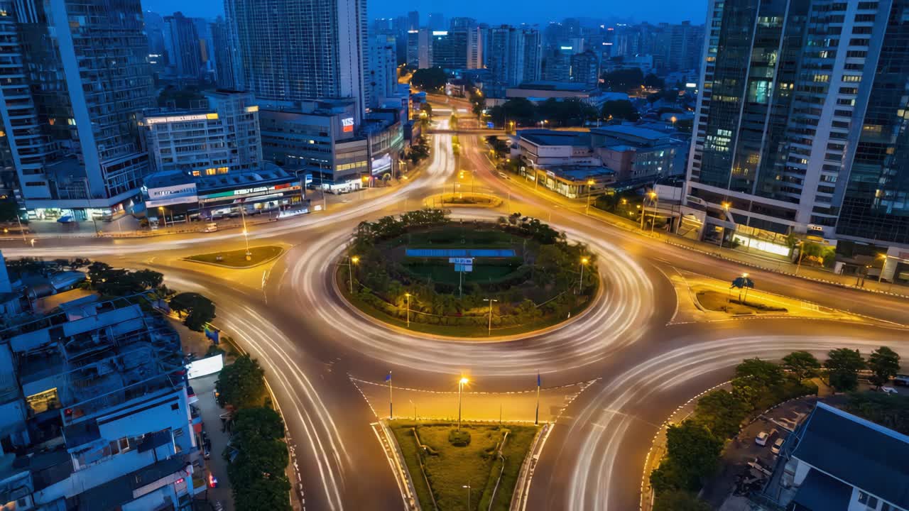 Nighttime City Roundabout with Vehicle Light Trails