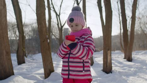 children kid tourist blogger browsing on mobile phone, publishing new photo post on social media