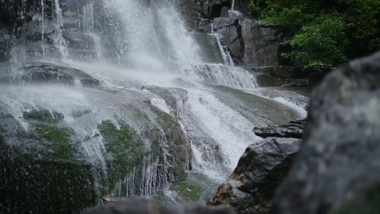 Appalachian Waterfall in the Summer. Low angle of water rushing down waterfall. 120 FPS.