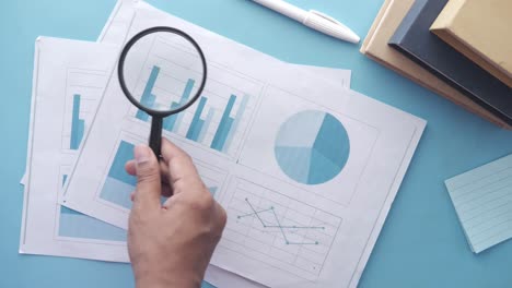 analyzing data with magnifying glass