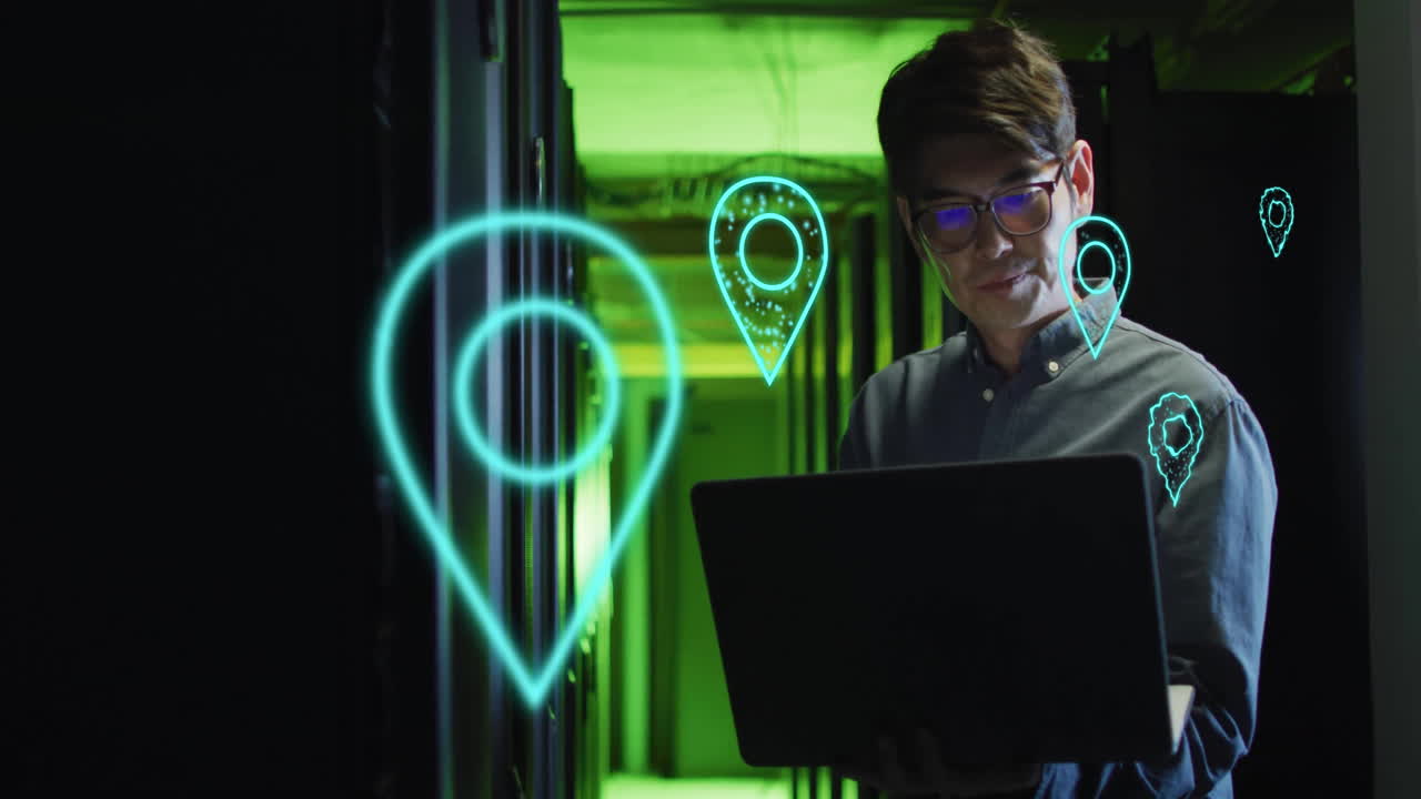 Working on laptop, man surrounded by location pin animations in server room