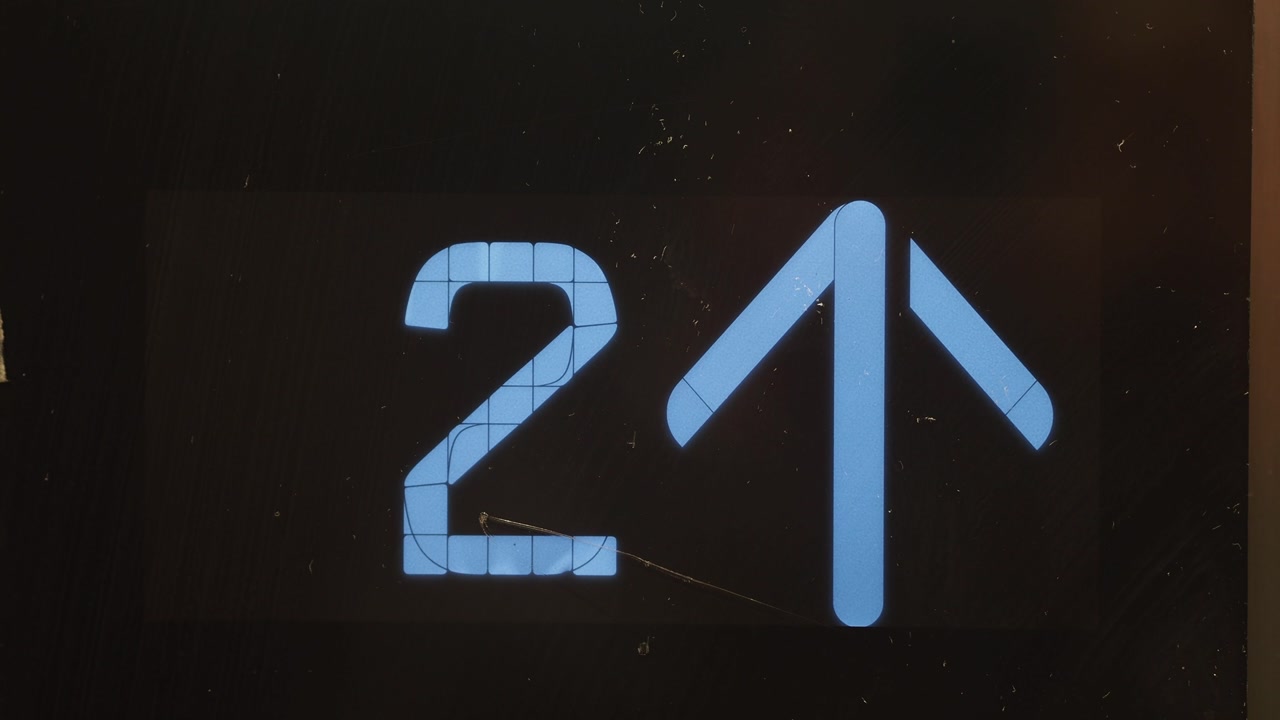 Digital Elevator Display Showing Floor Number and Up Arrow