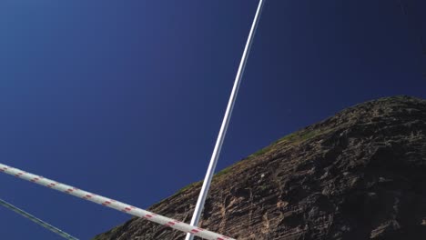 A-shot-from-below-of-a-cliff-with-a-nested-birds-colony