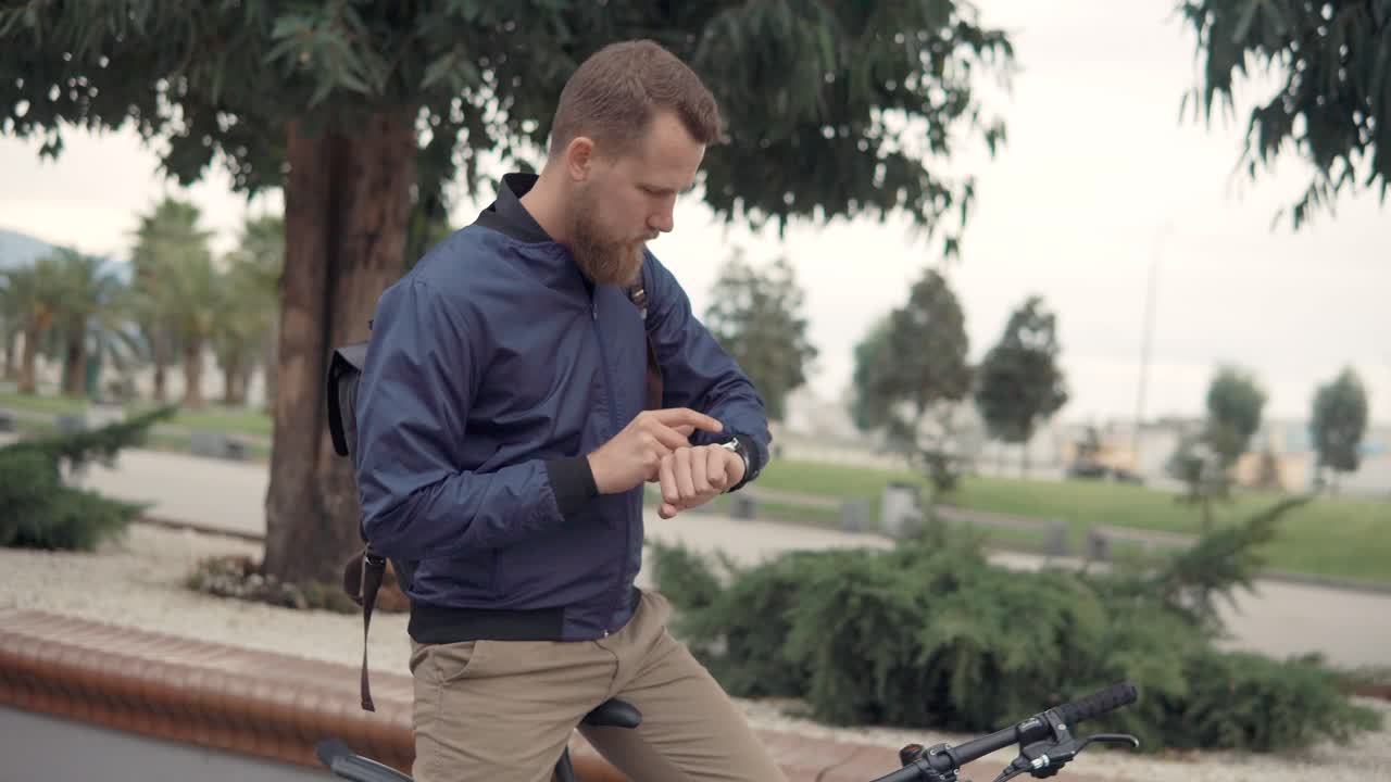 Man Checking Smartwatch Outdoors