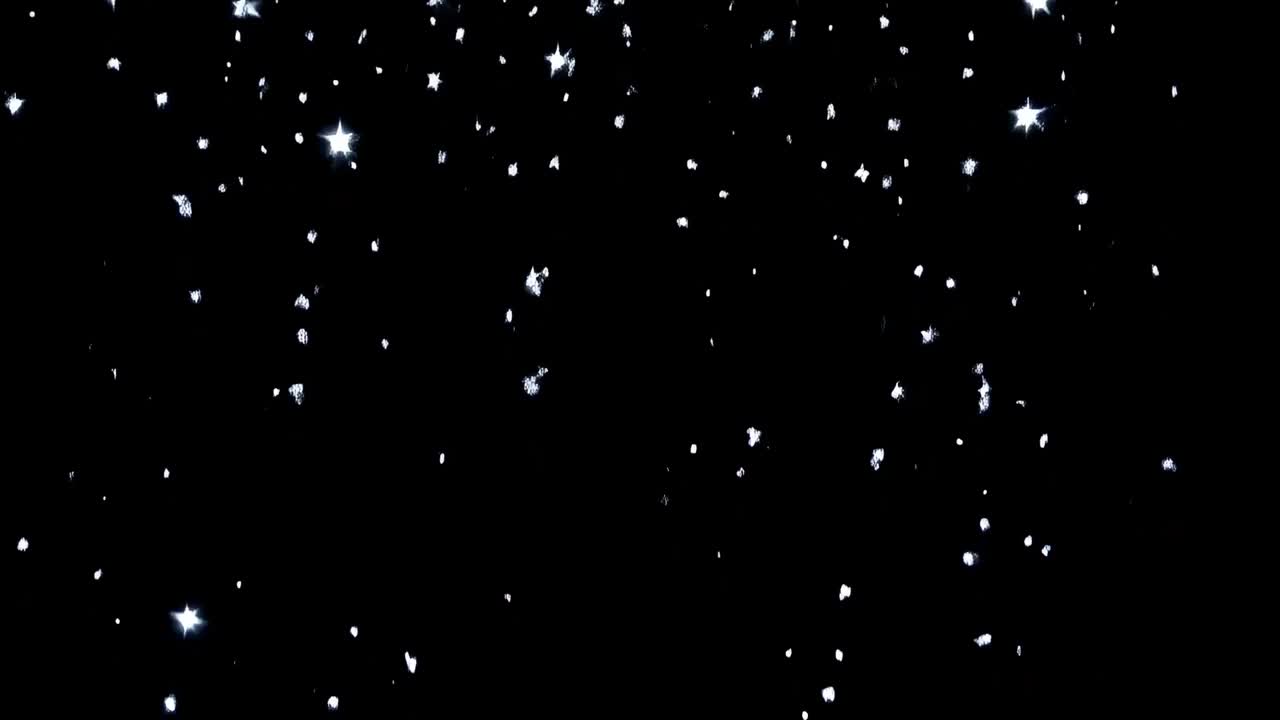Advancing camera revealing dense particle field in black void, with bright flares and diffuse haze